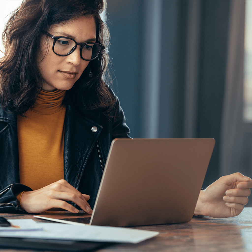 Woman opening a personal bank account online with Quaint Oak Bank on a laptop