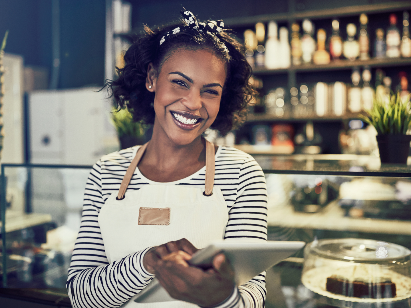 female cafe owner reviews her business deposit account from quaint oak