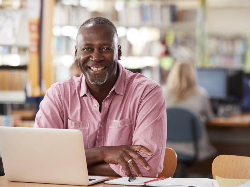 adult male student reading about home equity line of credit uses for education