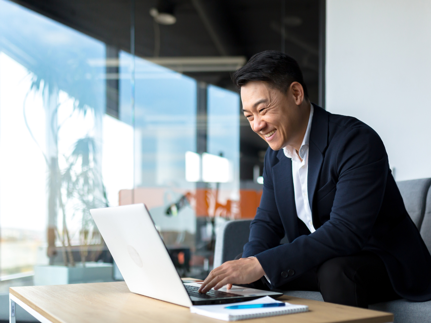 engineering company owner reviewing business cd options on laptop