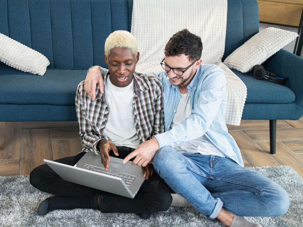 couple at home on computer reading about how to manage your bank account