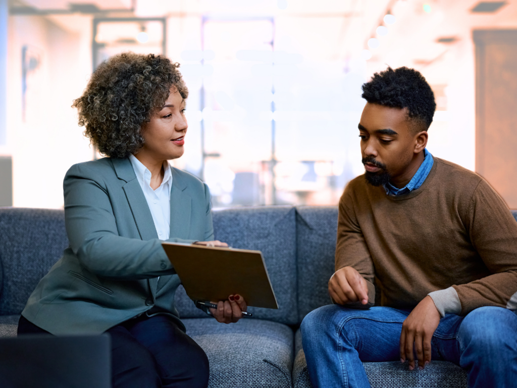 bank employee explaining the benefits of cd laddering to a banking customer