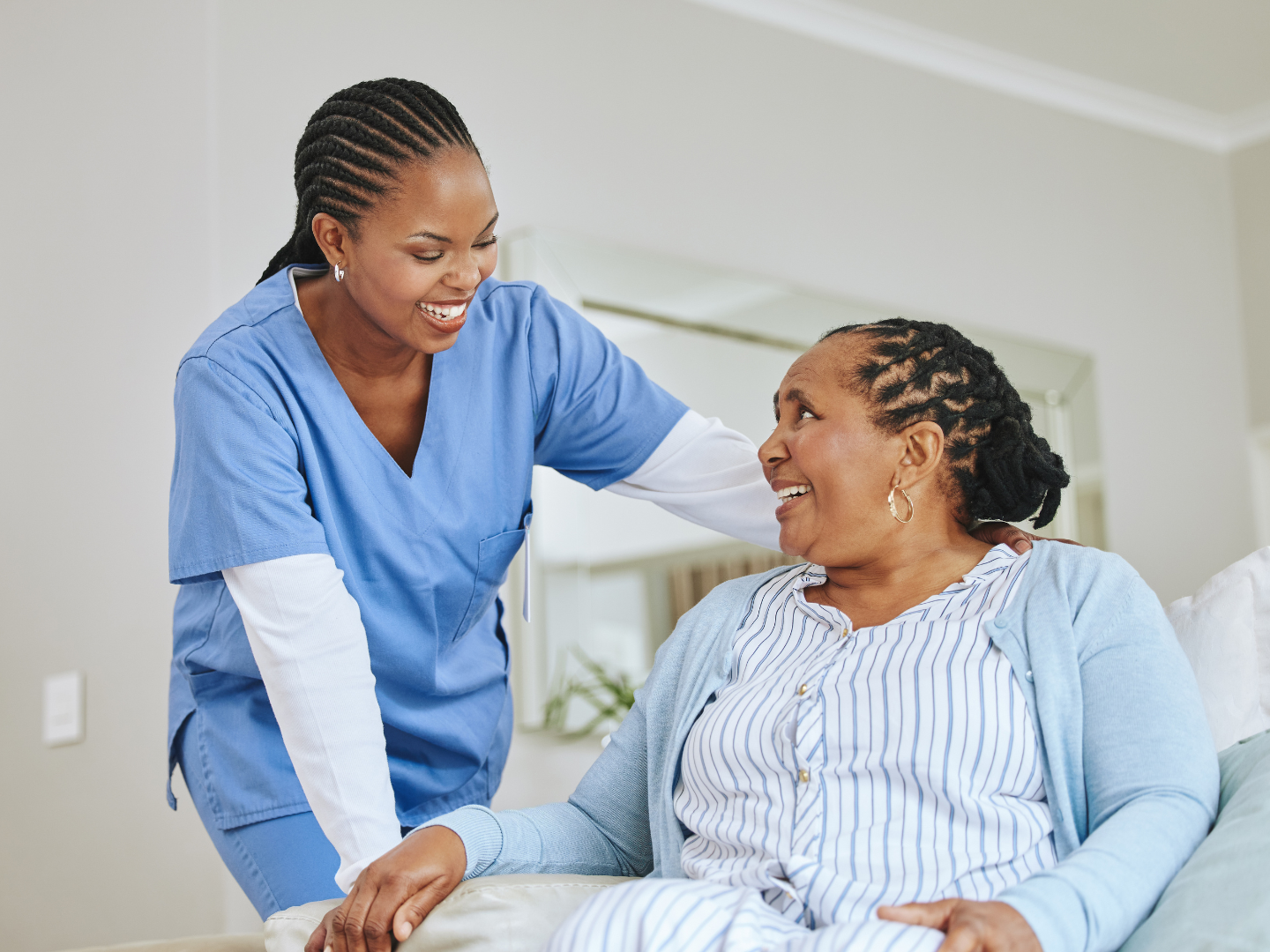 a female owner discussing with her patient the steps she made after learning more about growth for your home healthcare business to find financing to better serve their needs
