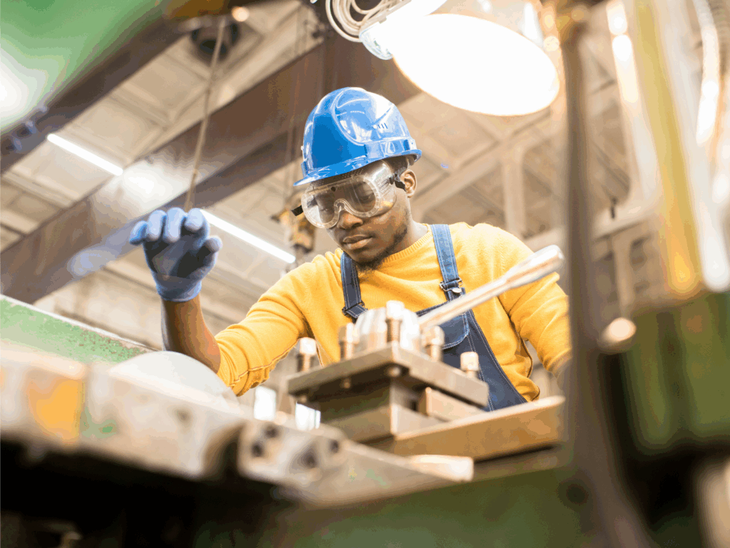 a man who owns a manufacturing company using equipment recently purchased with an equipment purchase loan from quaint oak bank