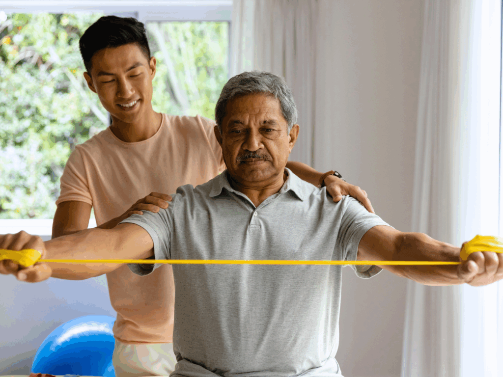 the owner of a physiotherapy practice works with a patient after learning more about smart banking for independent practices