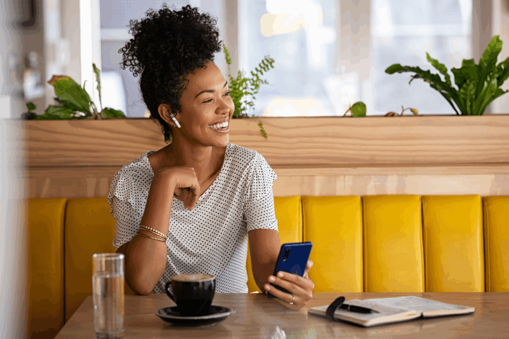 a woman who runs her own business speaking with a quaint oak bank team member about her accounts