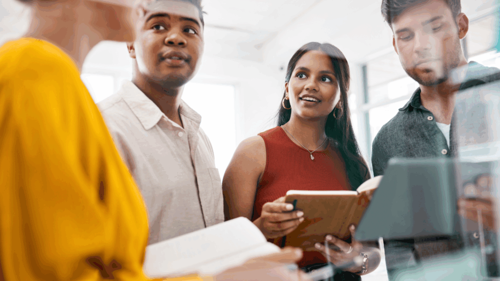 four coworkers reviewing potential business banking options for their practice
