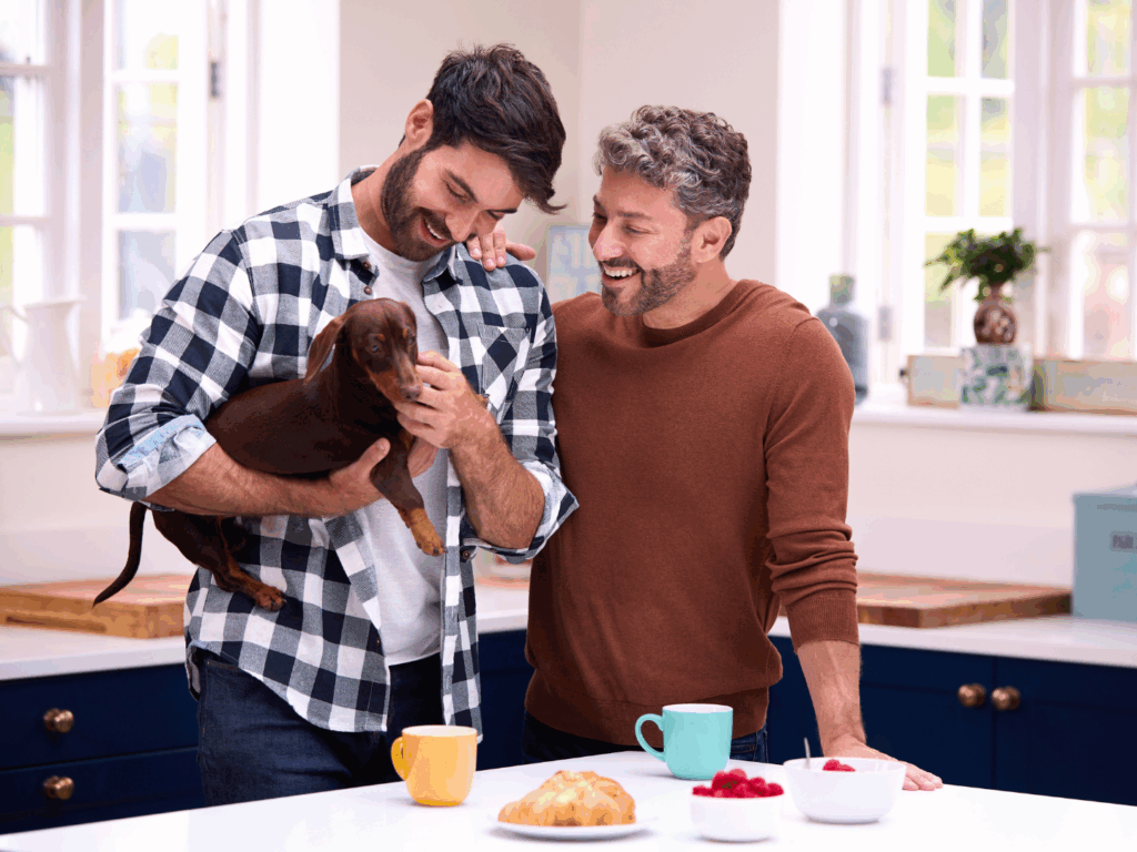a couple at home with their dog in their kitchen discussing options for their personal CD account