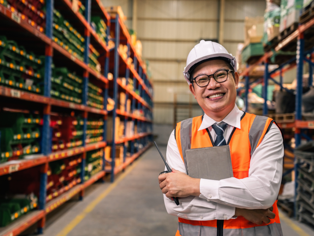 SBA Loans for Manufacturing Companies: What You Should Know 2 the owner of a manufacturing business stands in the warehouse he funded with an sba loan