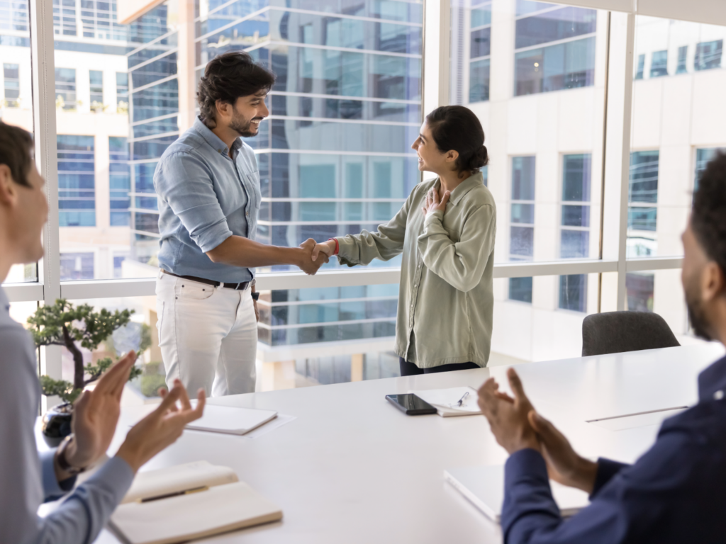 two business people shaking hands after learning more about SMB acquisition financing