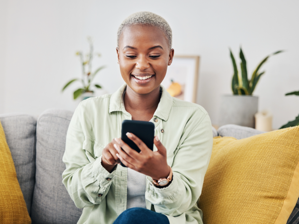 a woman reading privacy policies on her phone as she opens new accounts on line