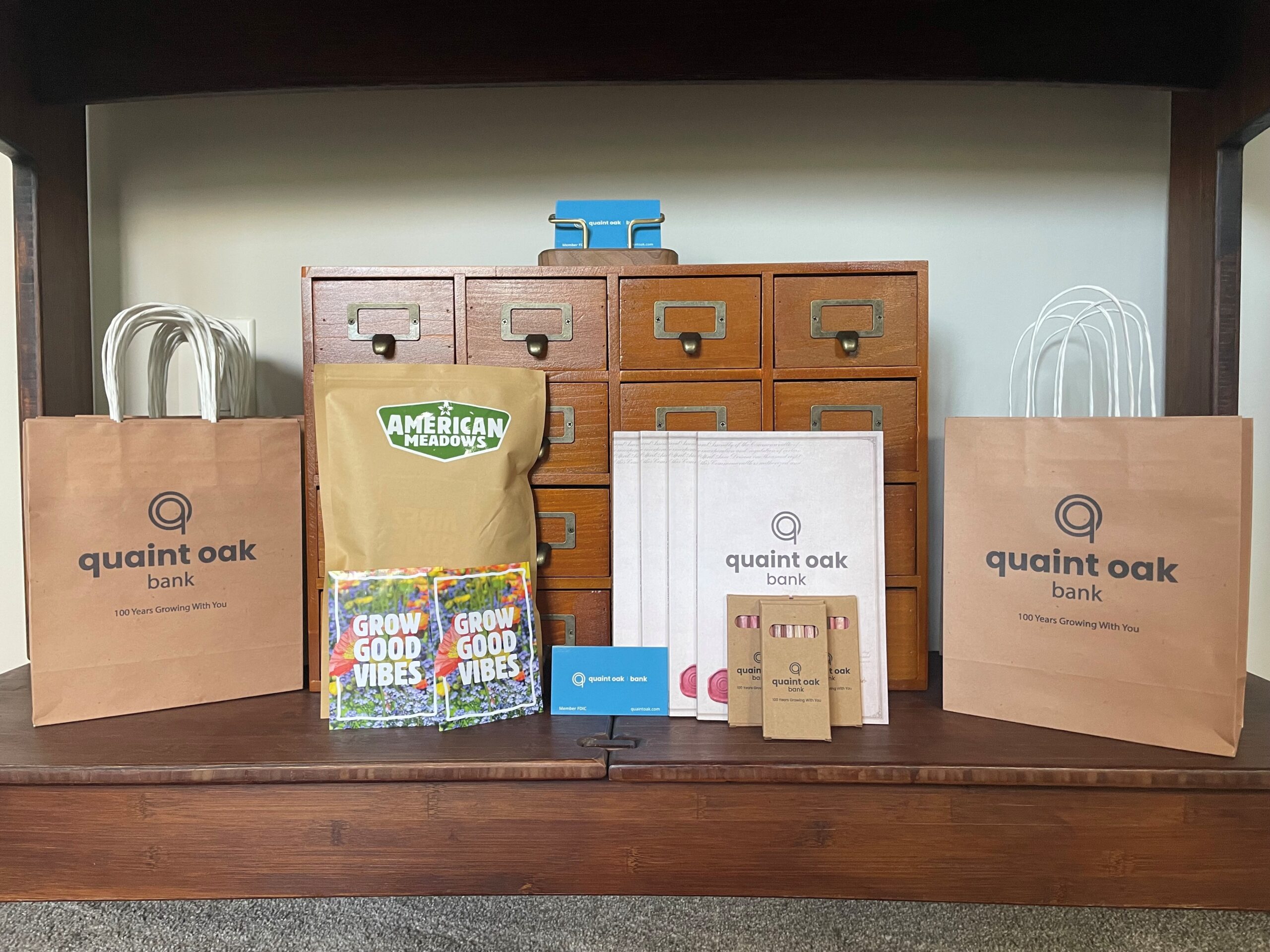 image of a vintage card catalog behind the items the Bethlehem library received from their partnership with quaint oak library
