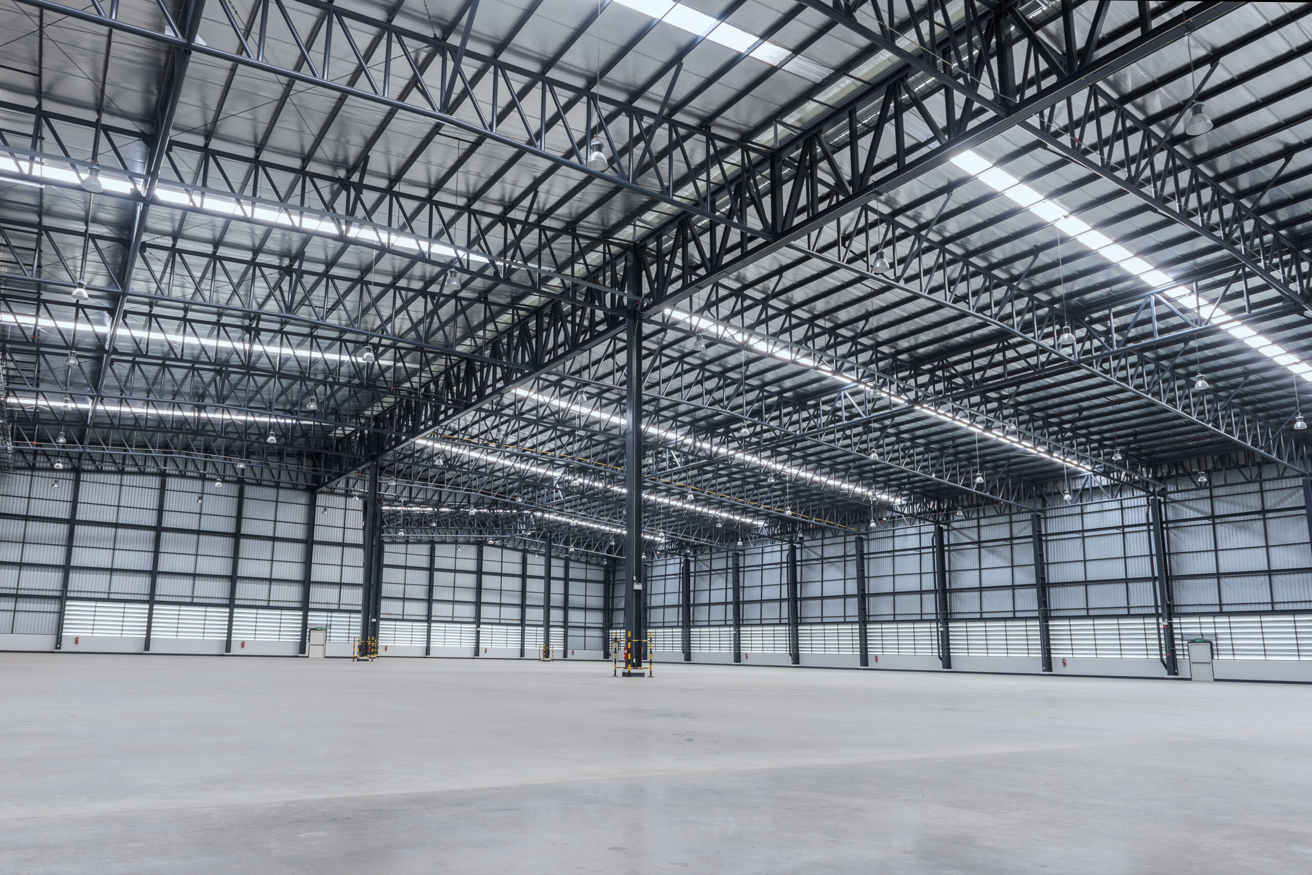 Interior of empty warehouse purchase with an owner-occupied commercial real estate financing